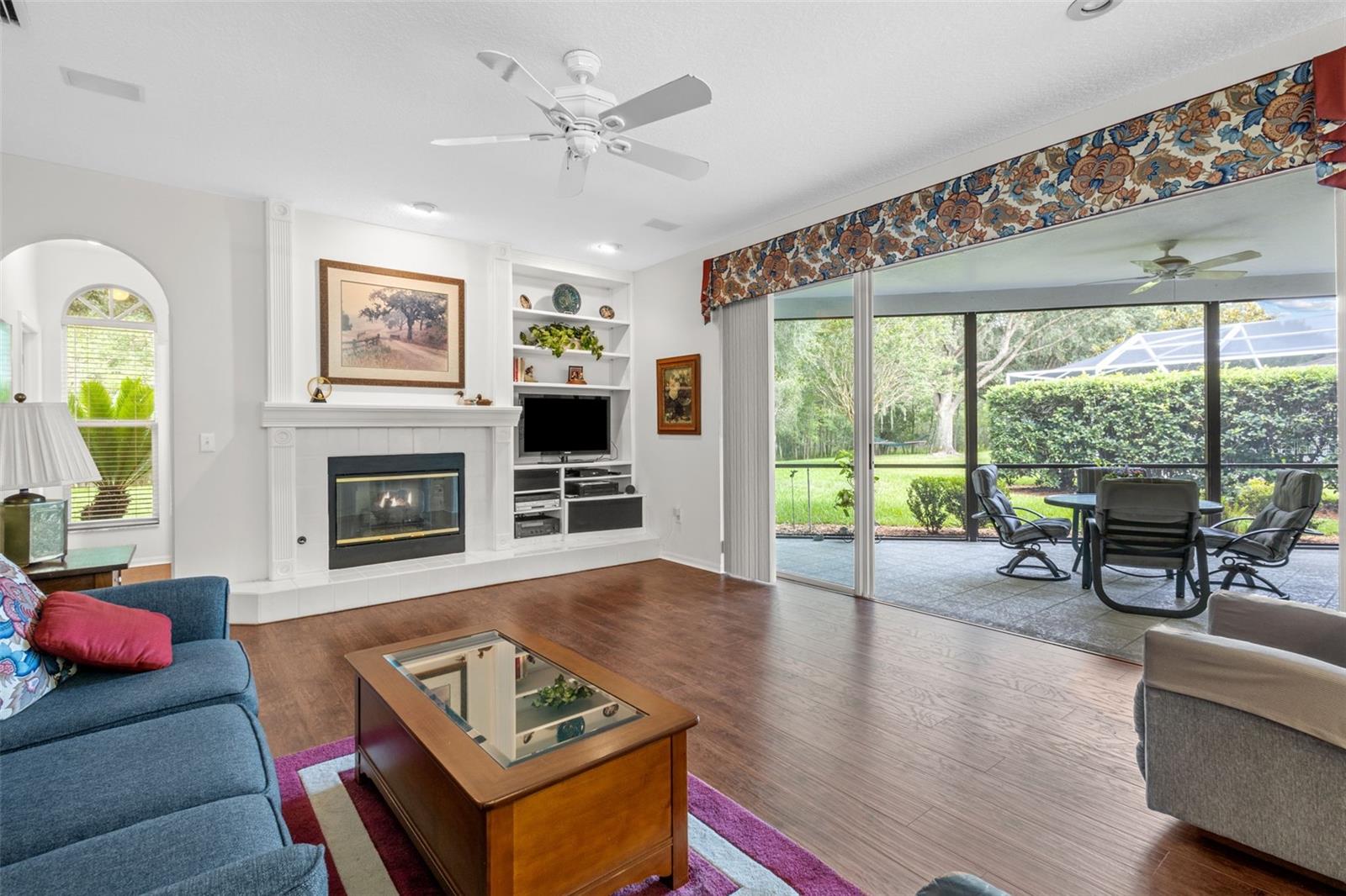 Family Room with sliders to outdoor screened in space