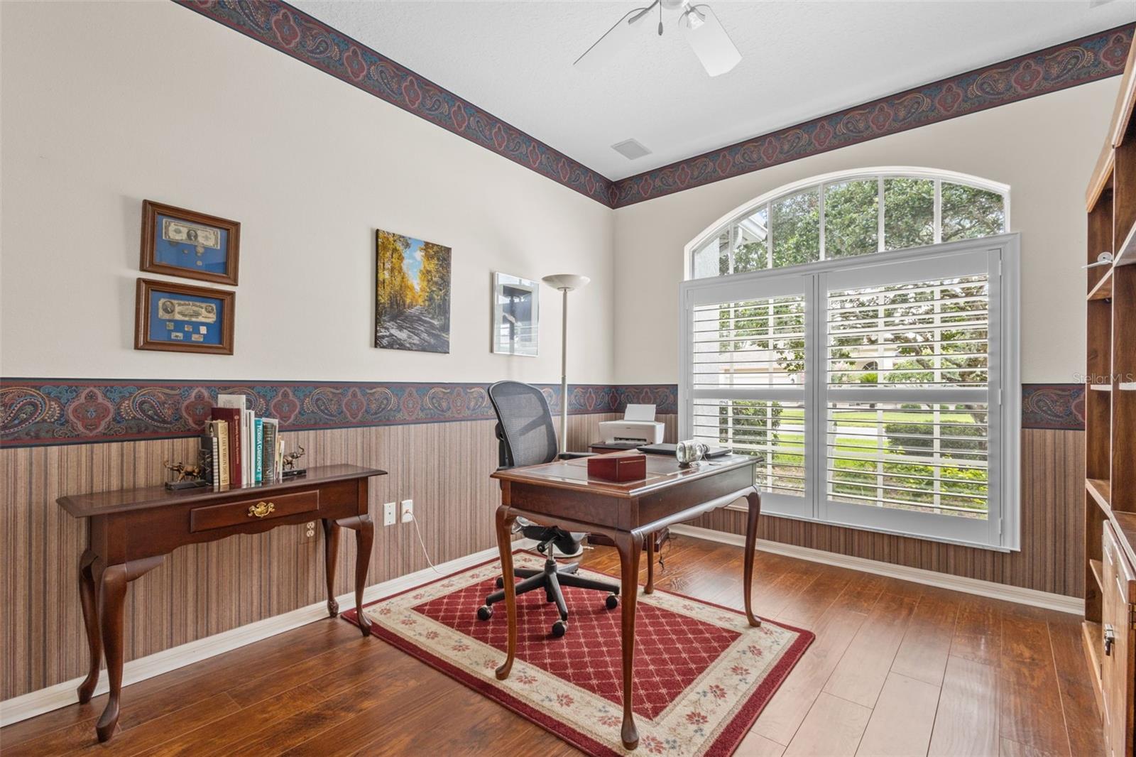 Office area is located just outside of primary suite and across from formal living room