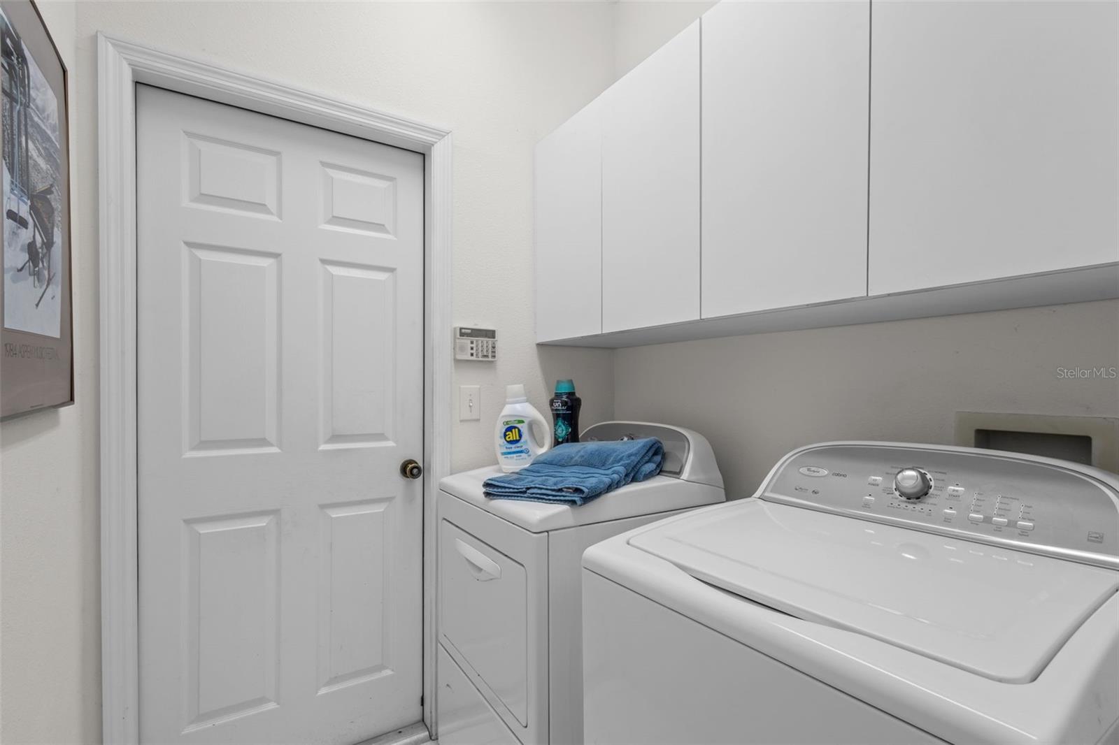Laundry located adjacent to kitchen, door leads to 3 car garage