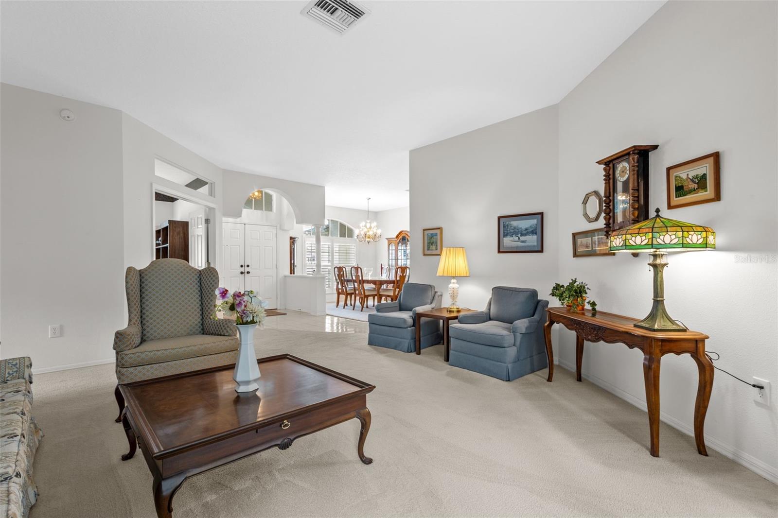 Formal Living room adjacent to dining room at front of home