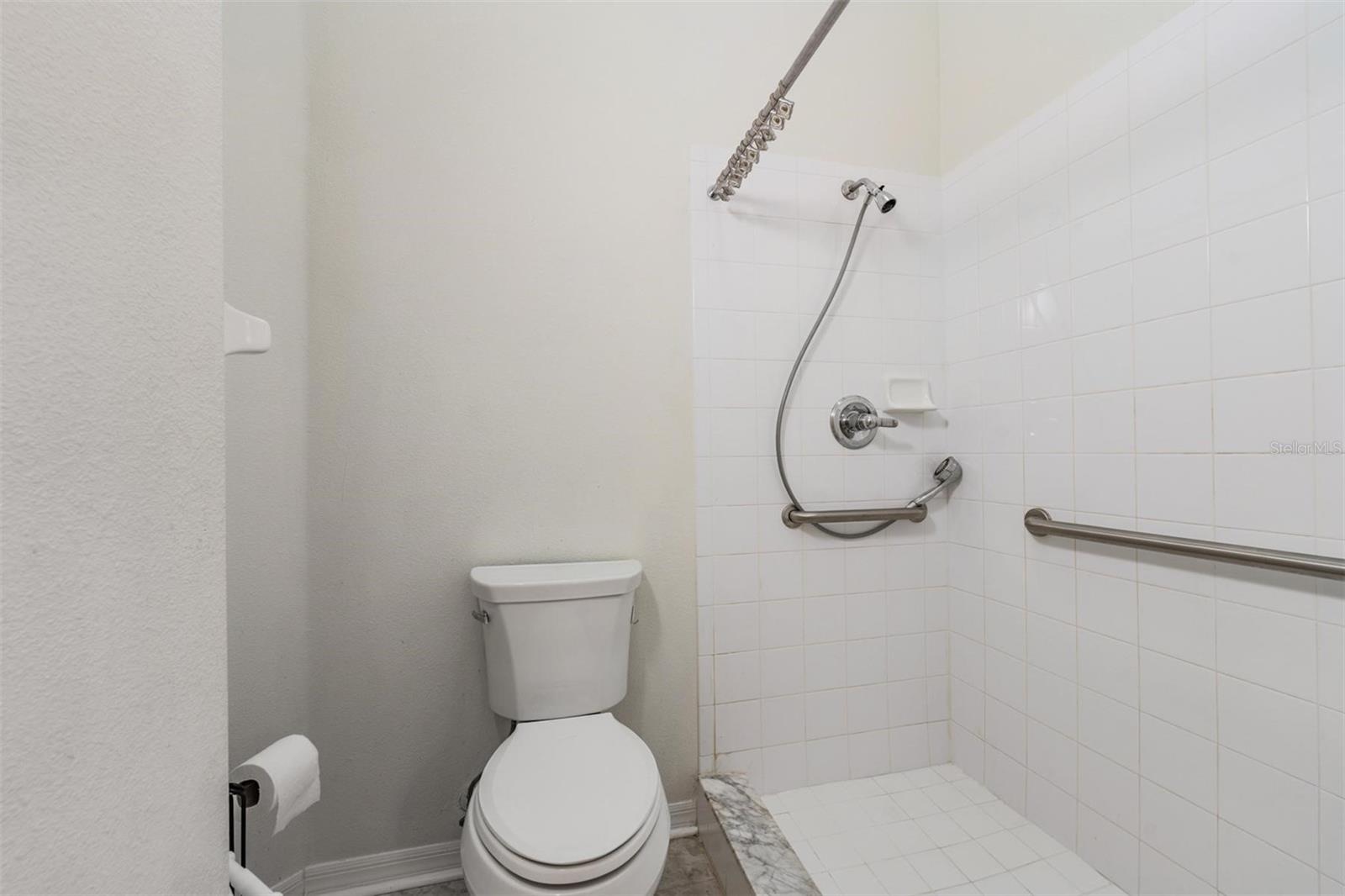 Master Bathroom with handrails in the shower.