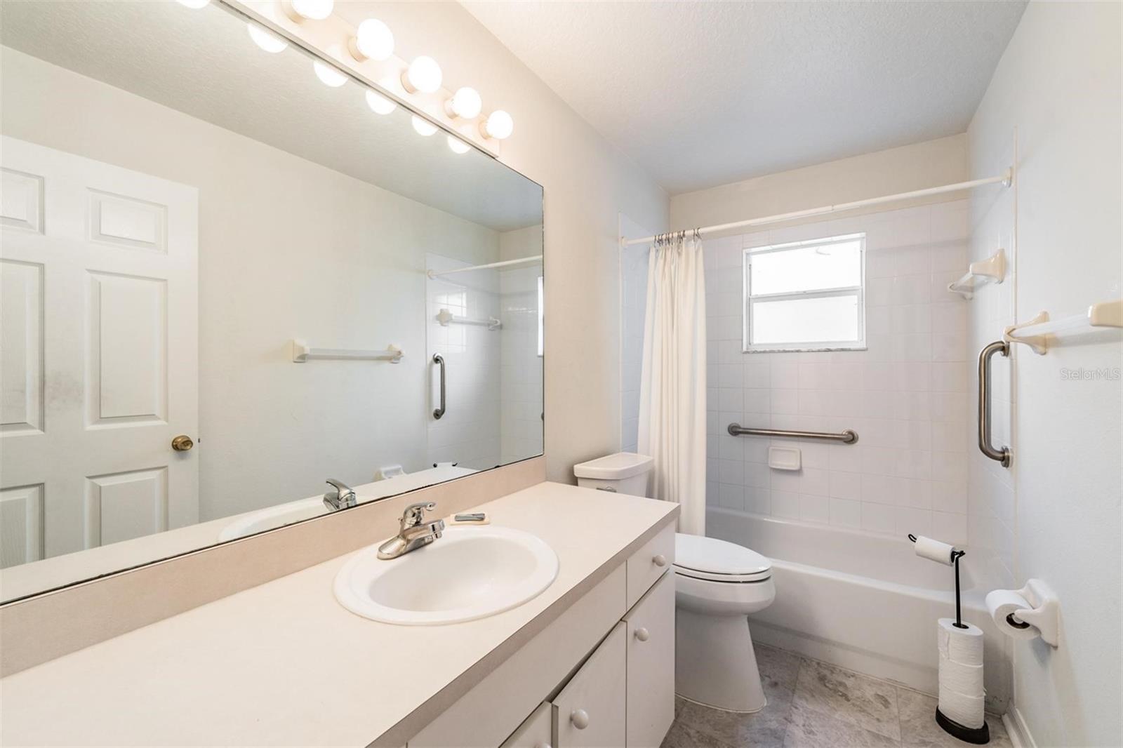 Guest Bathroom and support handles for the shower.