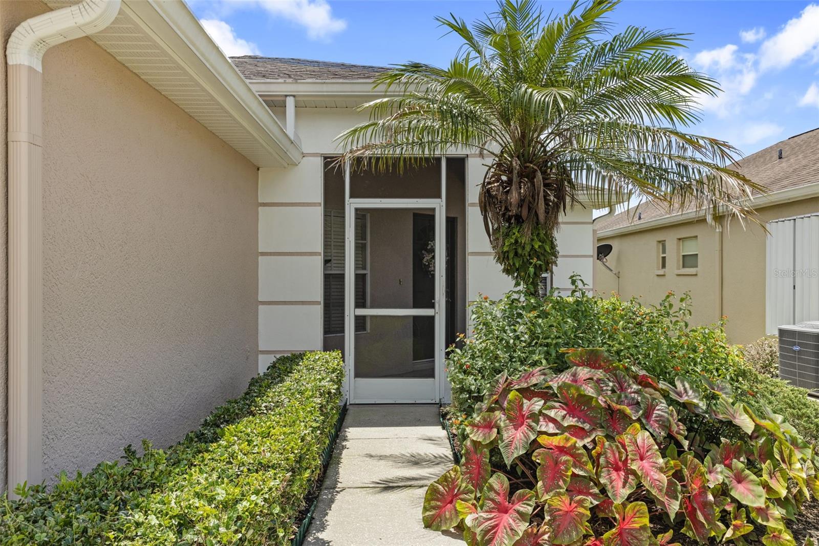 Private side entrance with screened in porch