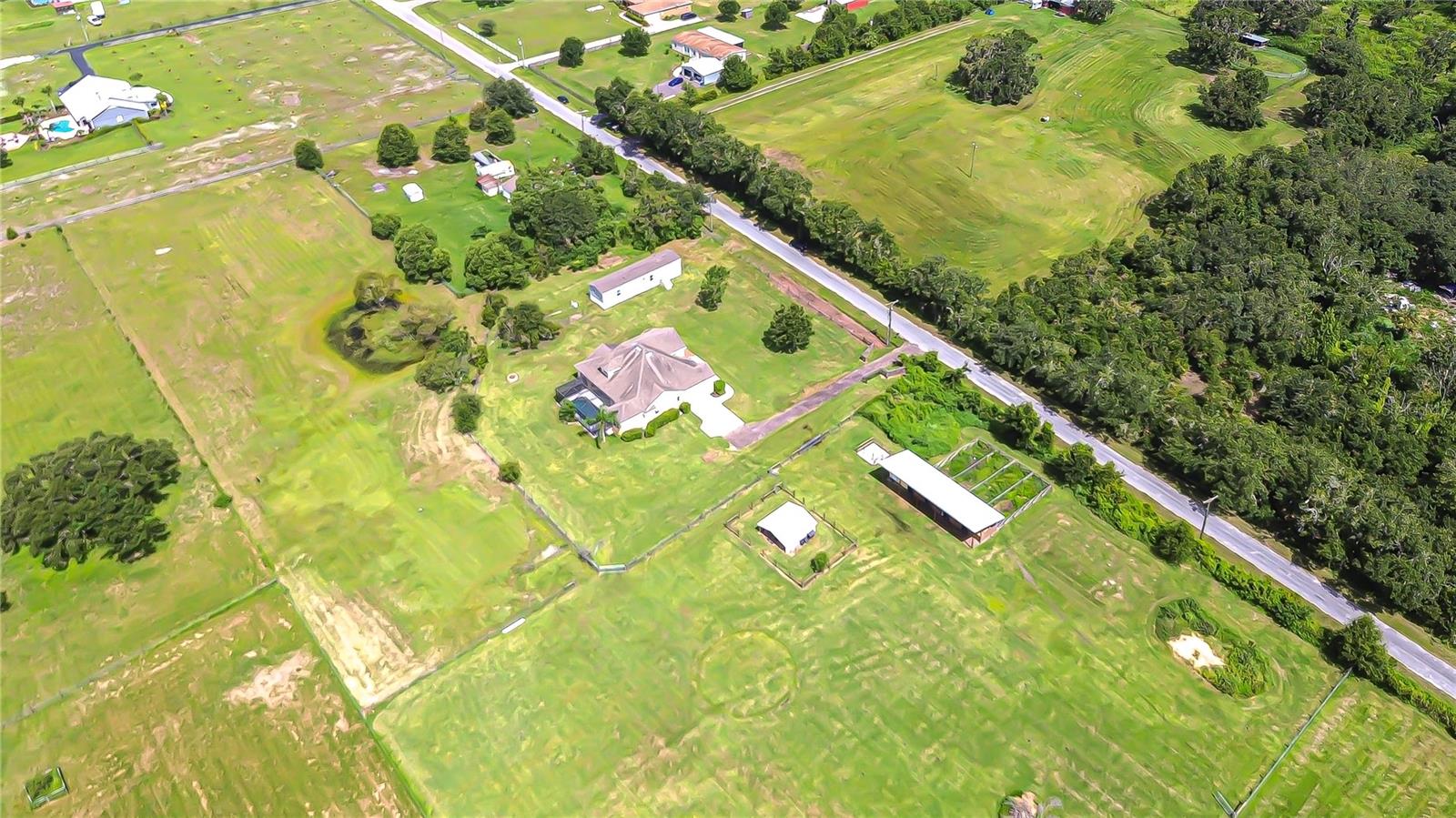 Aerial shot of both homes and outbuildings!