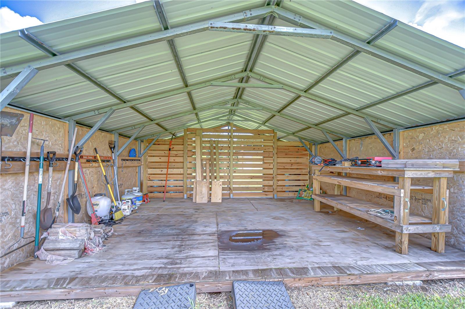 Separate hay and feed shed with tool storage!