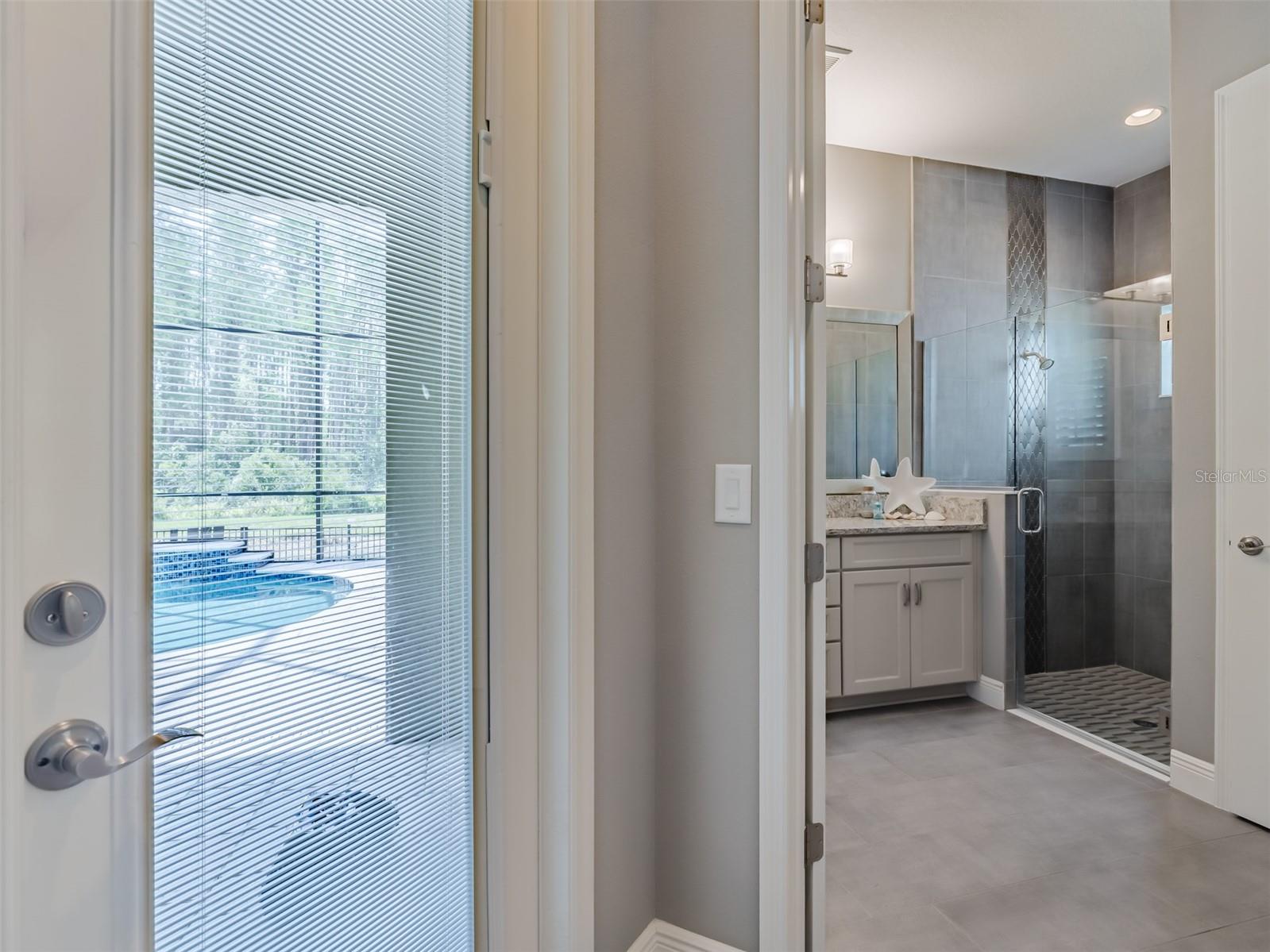 Downstairs suite hallway, bathroom, access to pool area
