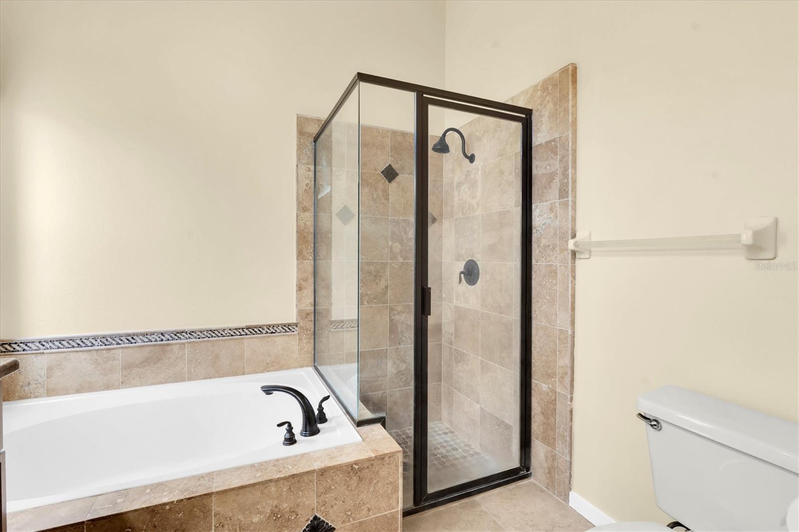 Soaking tub and separate glass enclosed shower