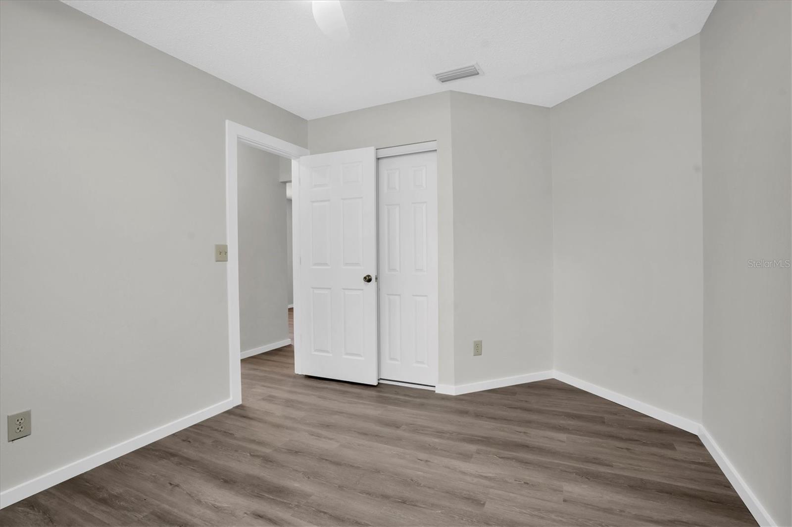 Bedroom 2 with NEW Luxury Vinyl Plank flooring