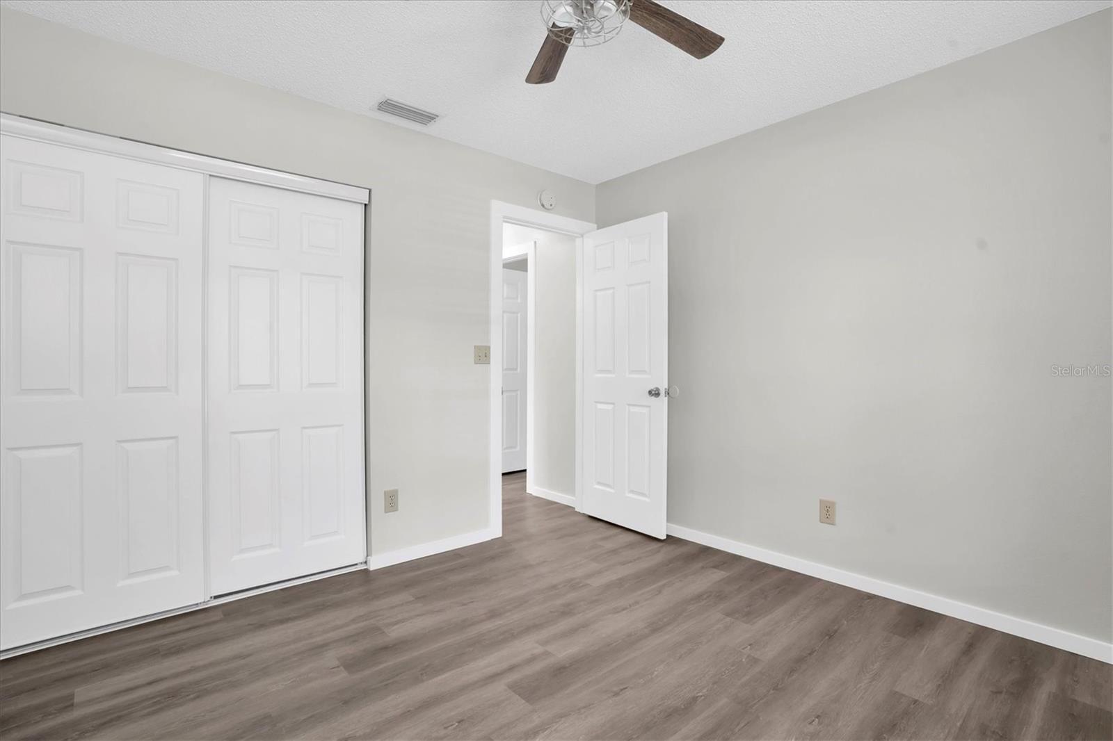 Bedroom 2 with NEW Luxury Vinyl Plank flooring