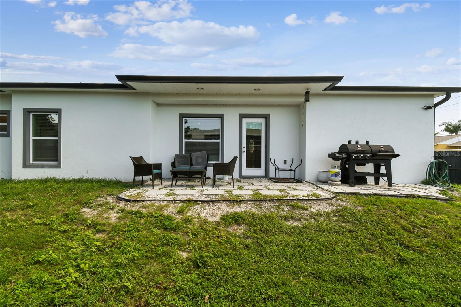 Rear home view - Door into Great room - Hurricane Rated Windows