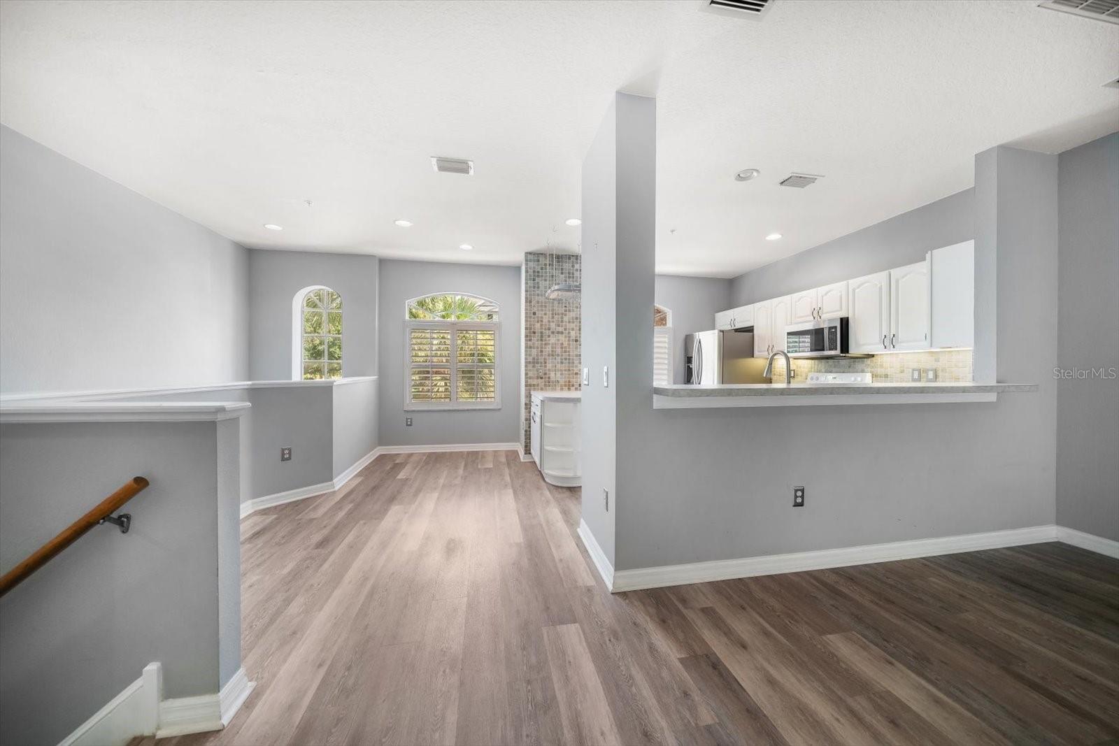 View from living room to dining area and kitchen