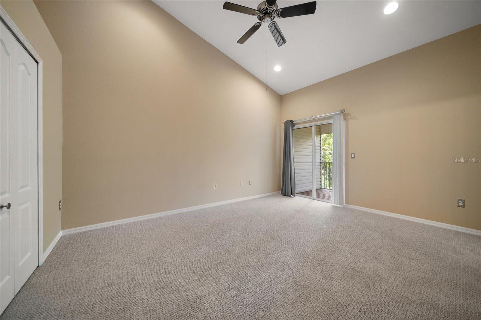 Large primary bedroom with vaulted ceilings