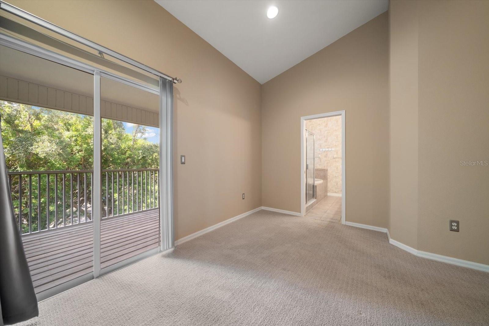 Sliding glass doors to private screened balcony