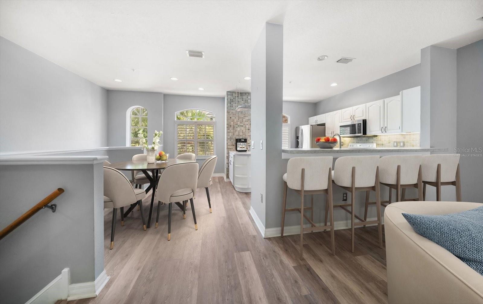 Virtually staged dining room and breakfast bar