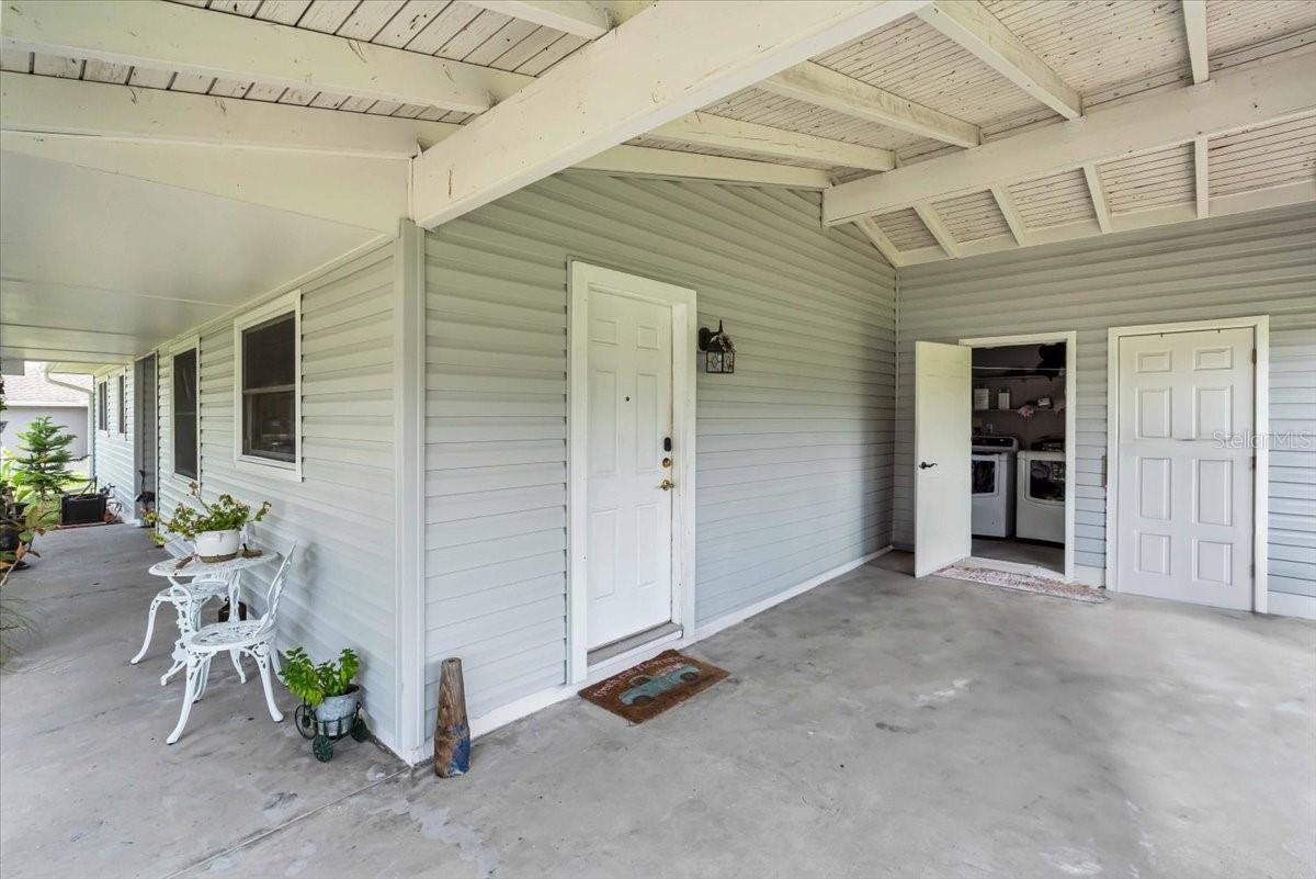Car port with laundry room and storage room