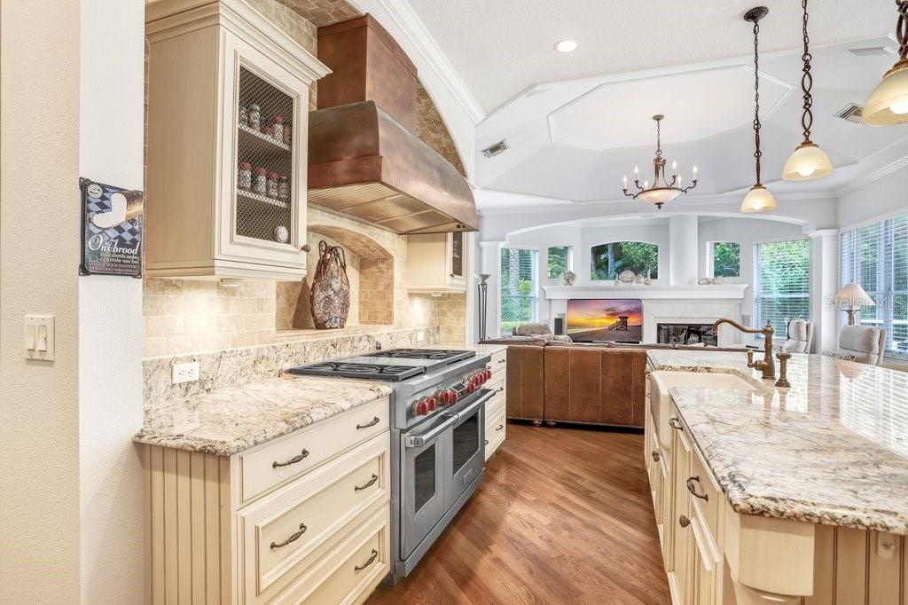 Wolf Oven and 6 Burner Gas Range with Custom Copper Vent Hood