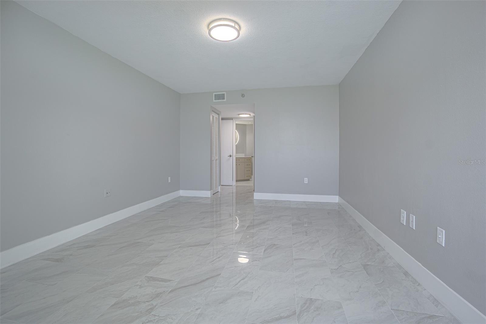 GUEST BEDROOM IS A TRULY SPLIT PLAN WITH A WALK IN CLOSET