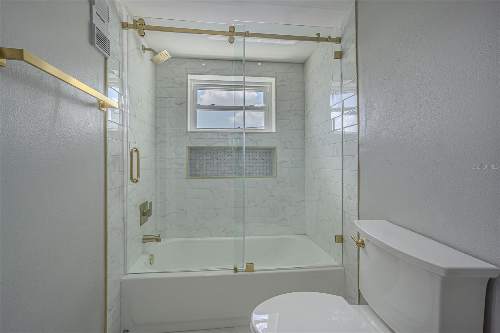 GUEST BATHROOM HAS A TUB/SHOWER
