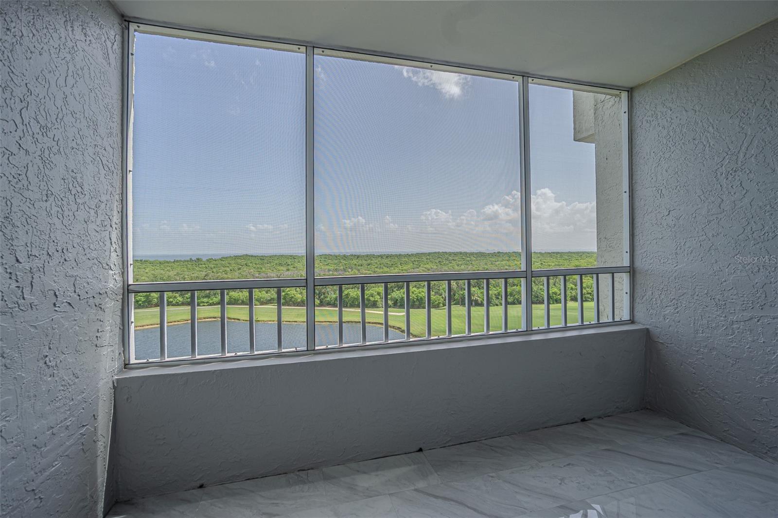 THE TILE CONTINUES INTO YOUR SCREENED BALCONY