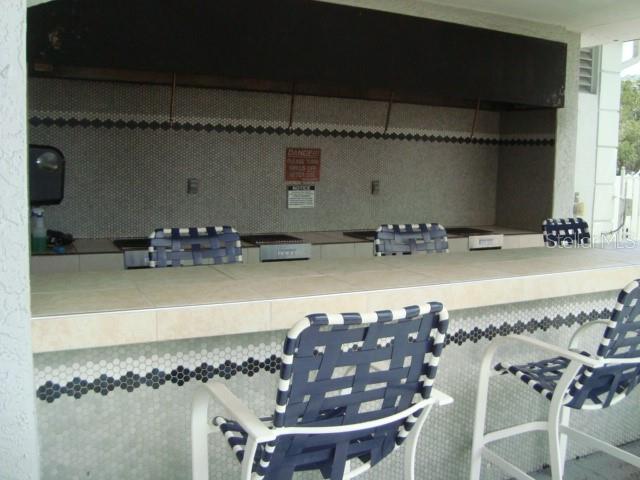 THE BAR AREA ALSO HAS A GAS GRILL FOR YOUR GRILLING