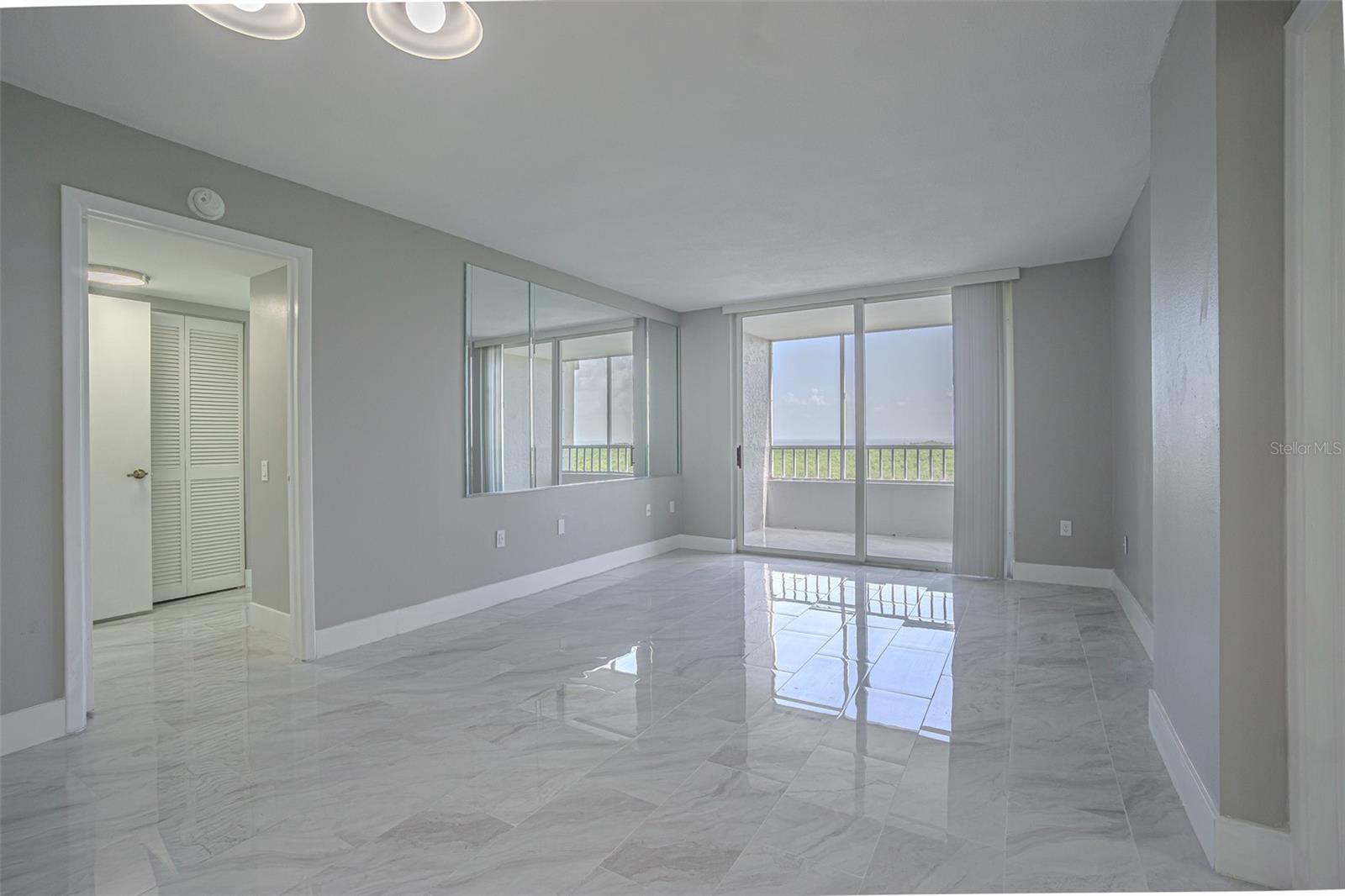 THE TILE FLOWS OUT INTO THE SCREENED BALCONY