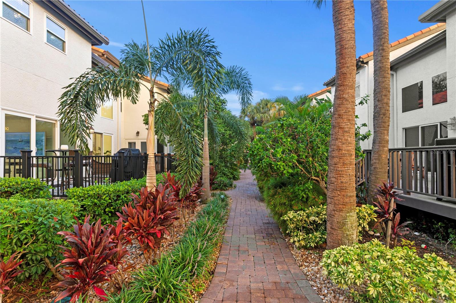 The neighborhood of Harbour Homes has interlocking paver driveways and walkways and lush mature landscaping