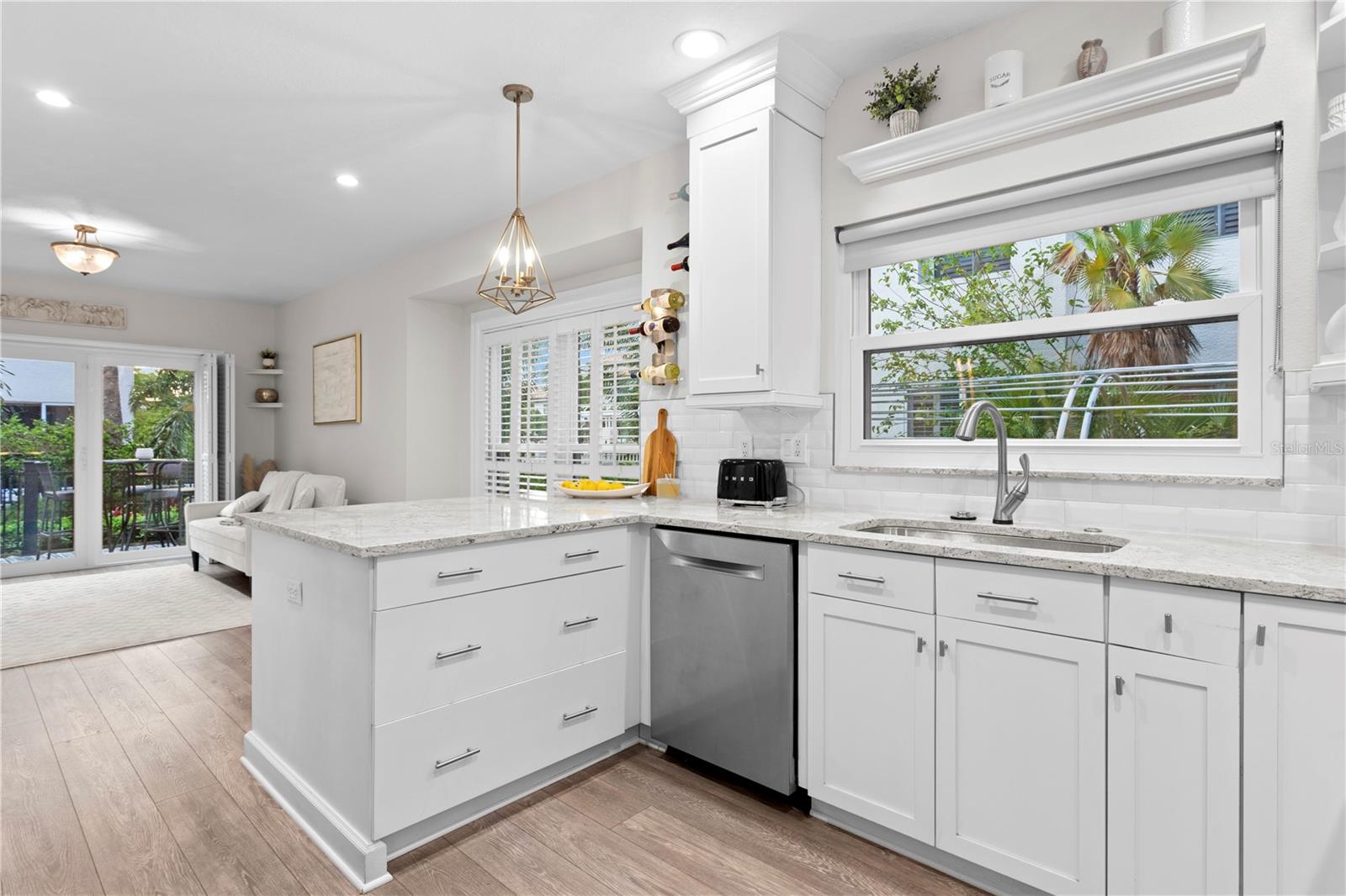 From the comfort of the family room, make your way into the beautifully updated kitchen, where modern touches and elegant details shine.