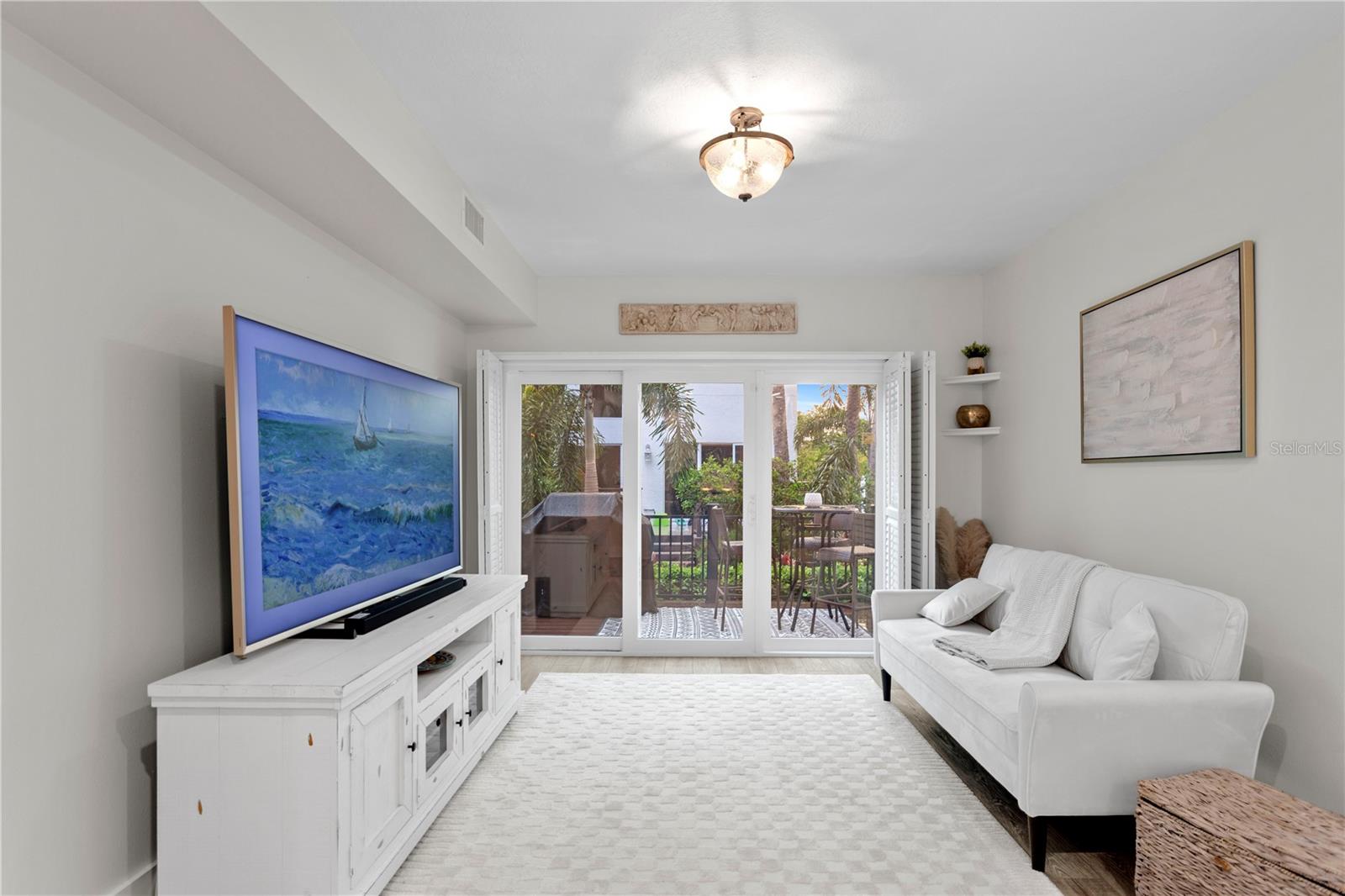 Connected to the kitchen, the additional living space offers seamless access to the outdoor deck, enhancing the flow for entertaining and relaxation.