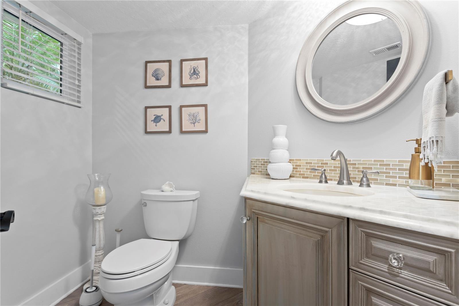 A nicely updated half bathroom is conveniently located on the first floor.