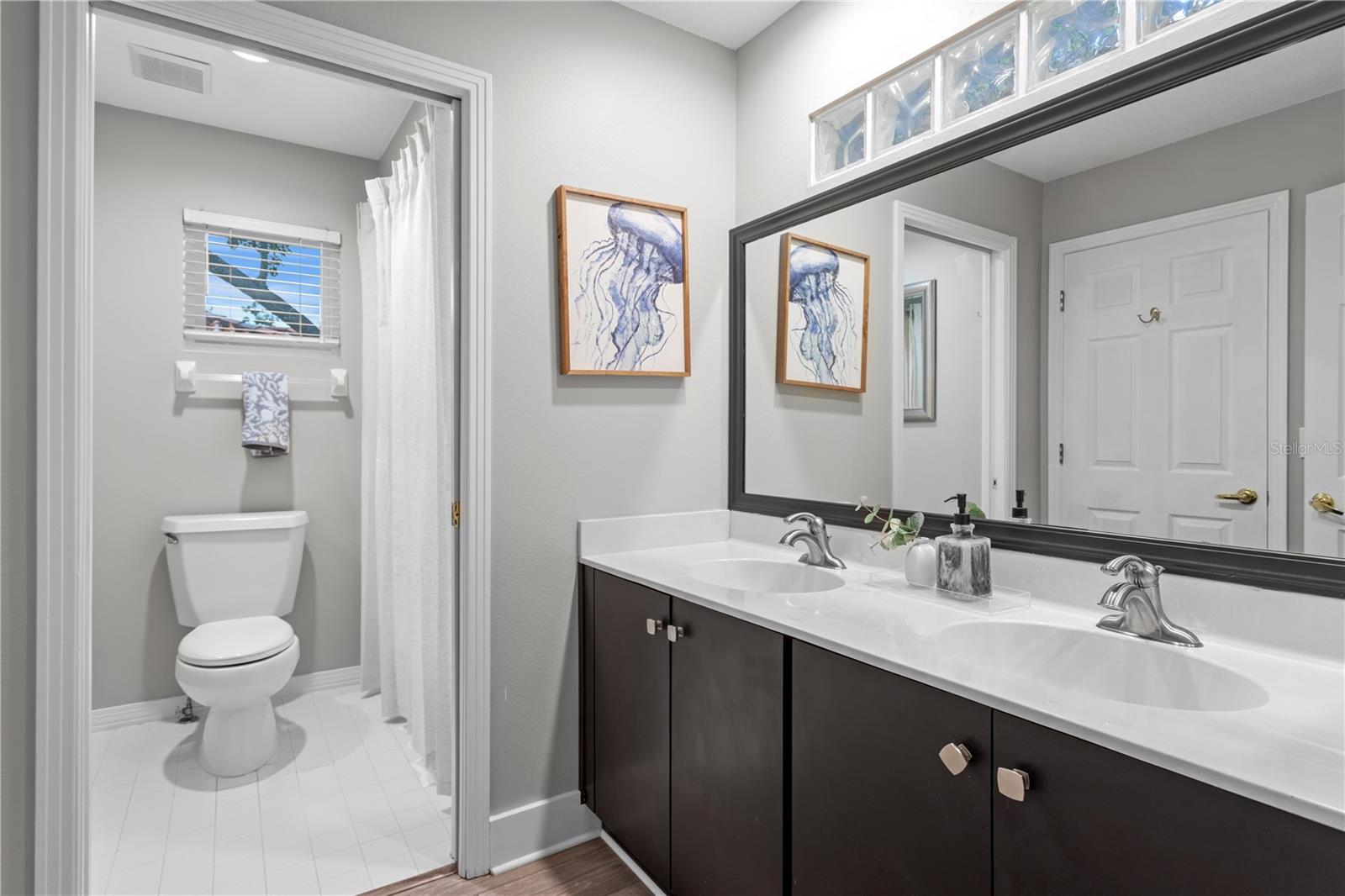 A well-appointed Jack & Jill bathroom connects Bedrooms 2 and 3—ideal for family or guests