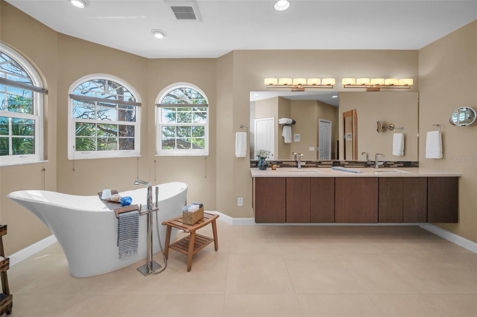 Freestanding tub with floating dual vanity