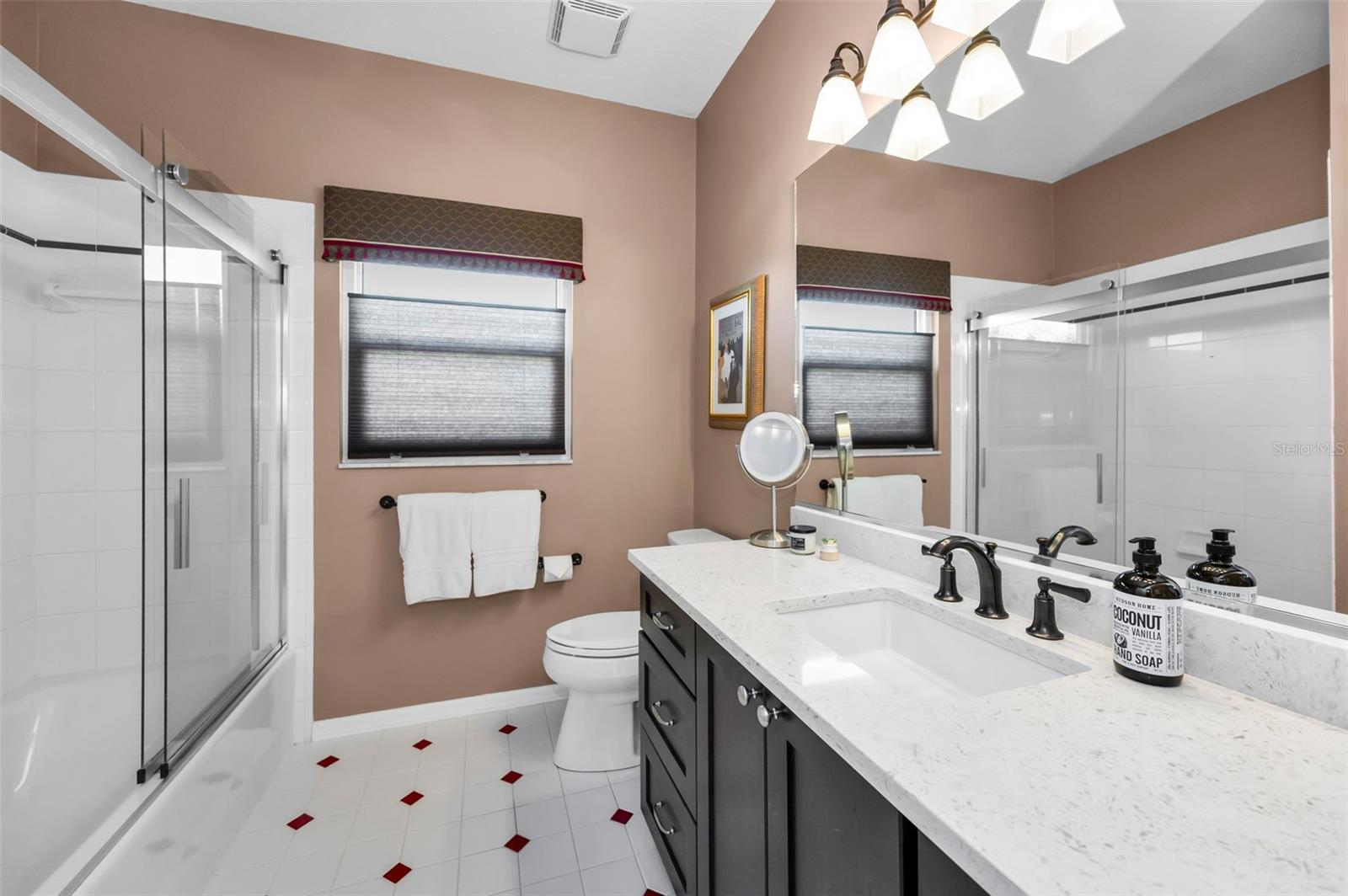 Bathroom with large vanity and linen closet