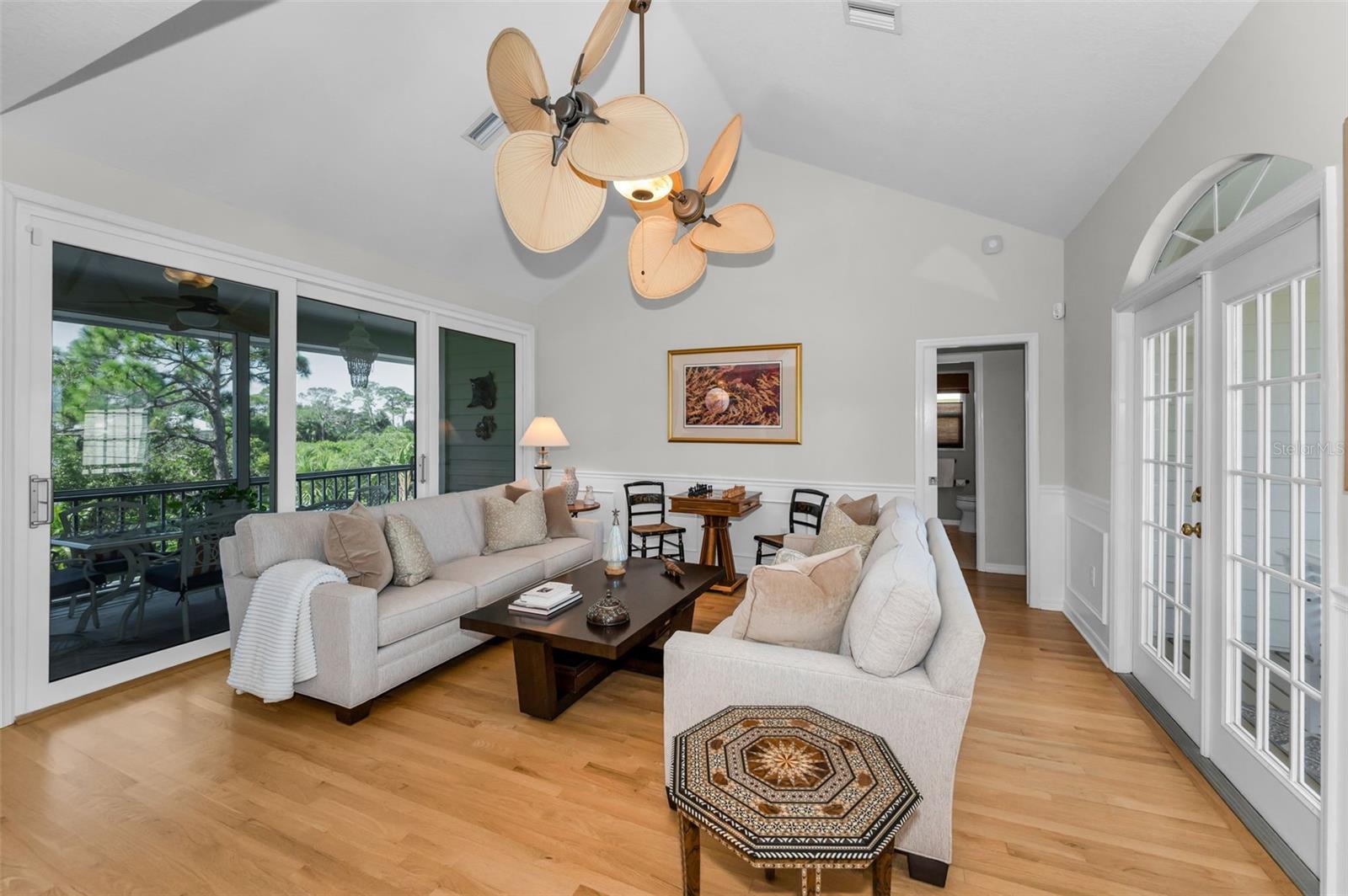 Living room with impact glass sliders