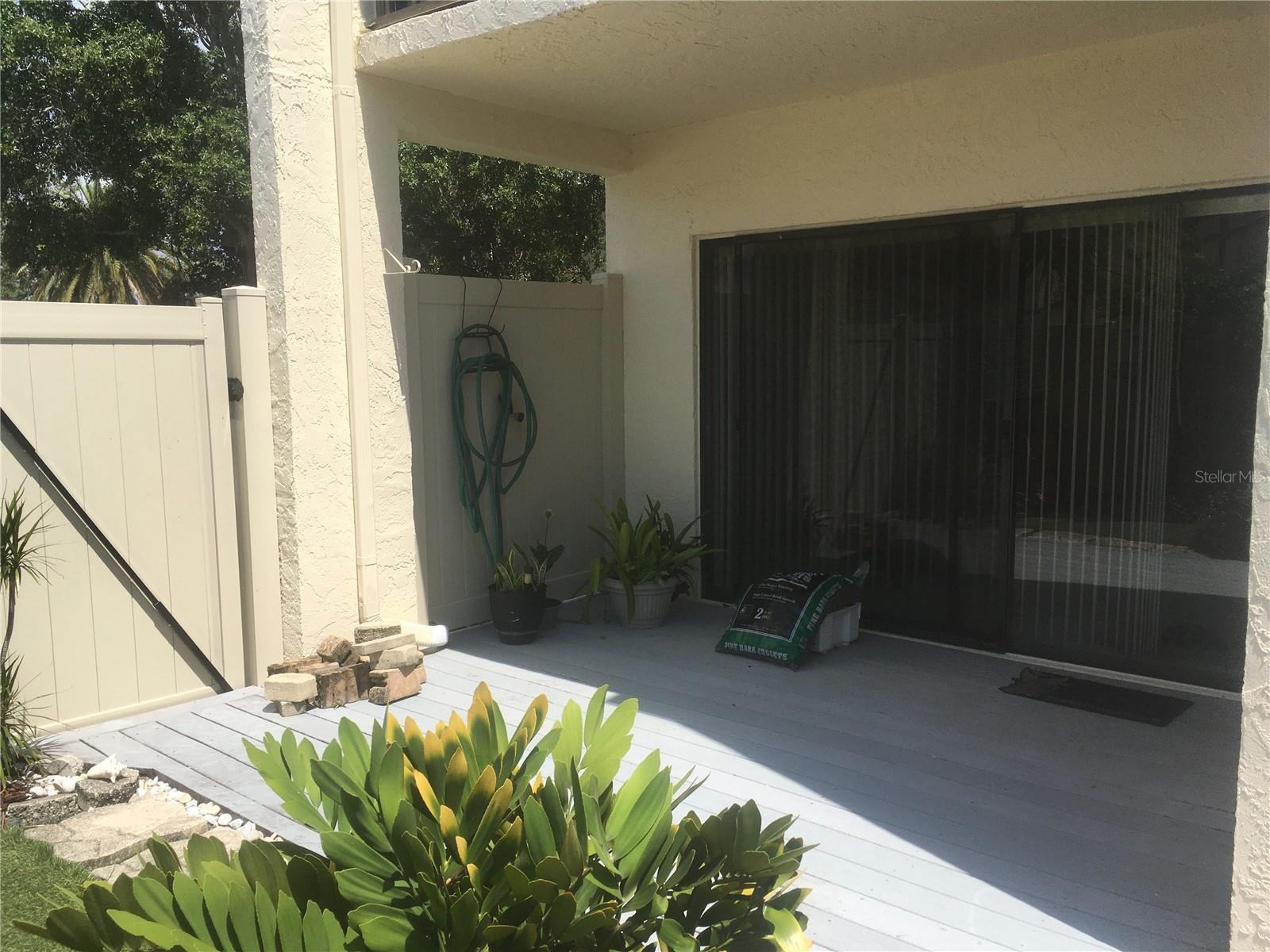 Deck and gate to the left