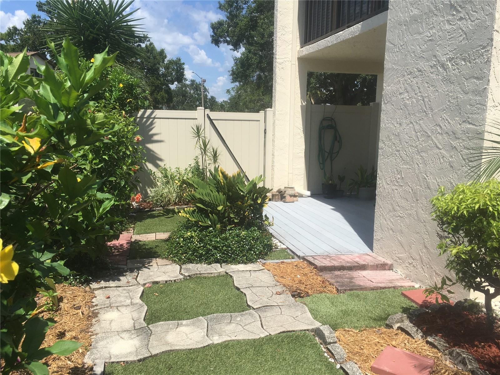 Yard looking towards deck and gate