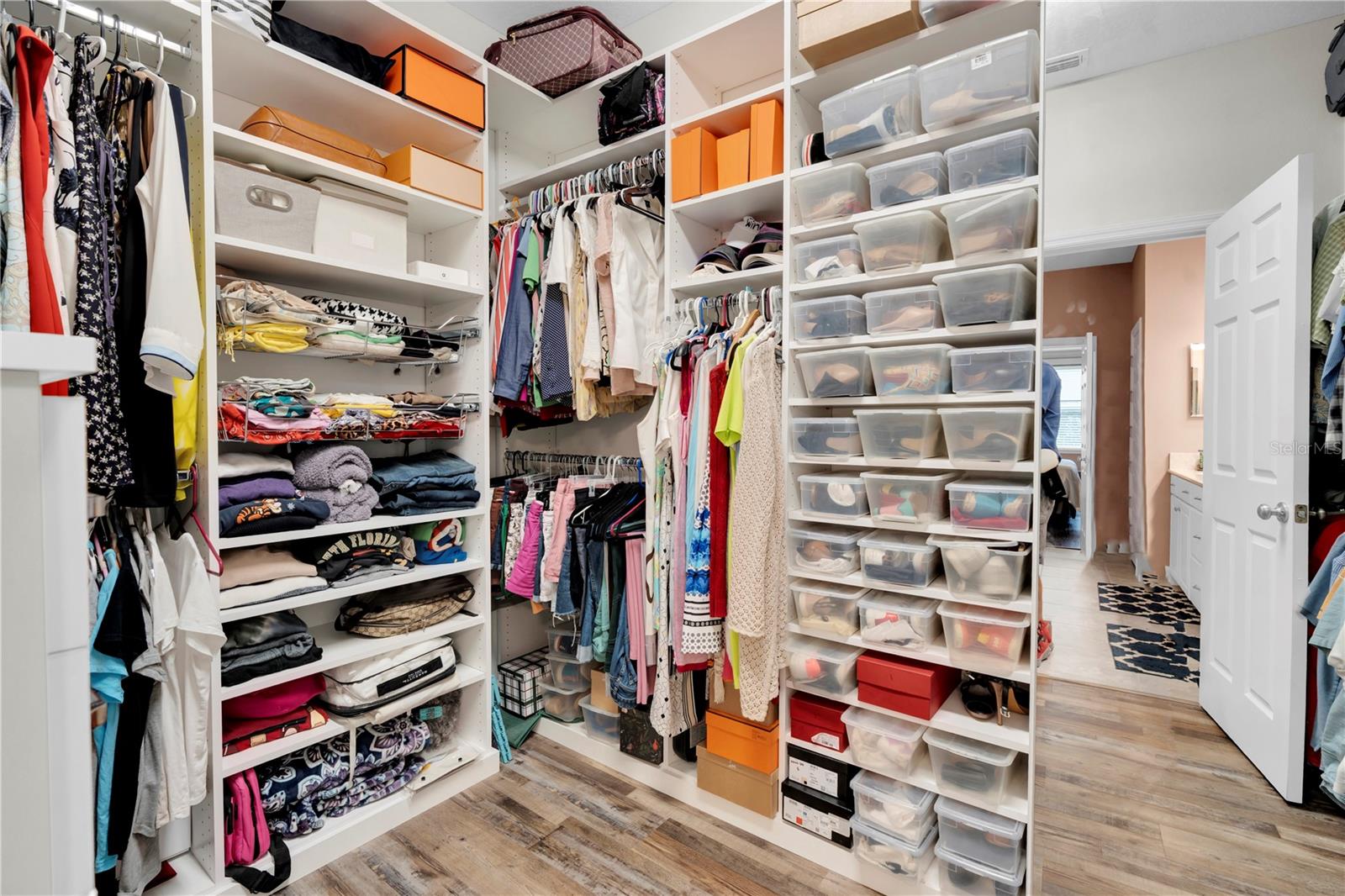 Custom walk-in closet in primary bedroom