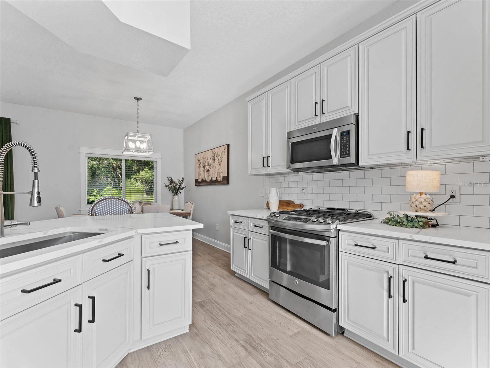 Quartz countertops and a  gas stove