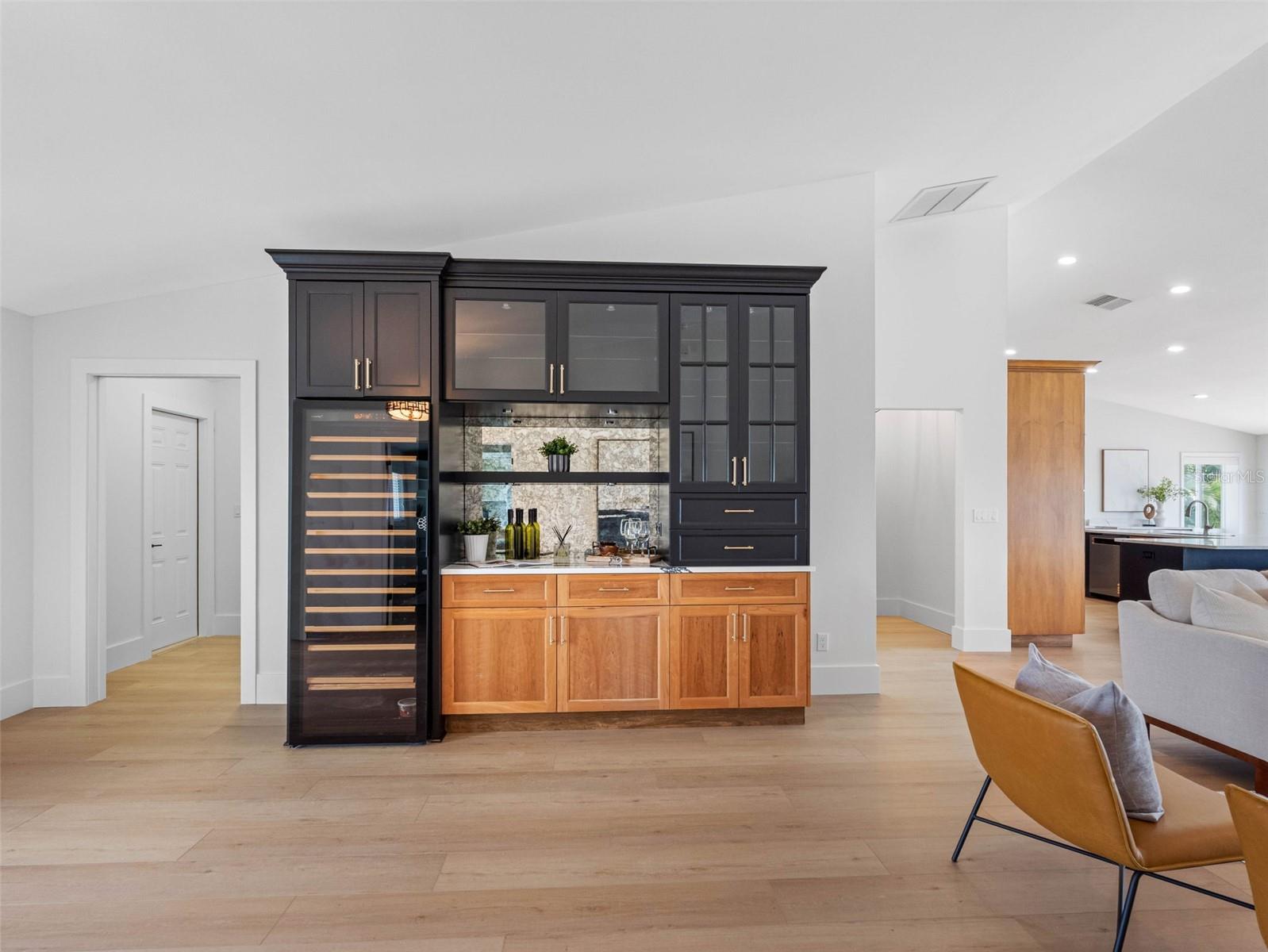 Bespoke, artisan-crafted built-in wine bar/fridge and cabinetry