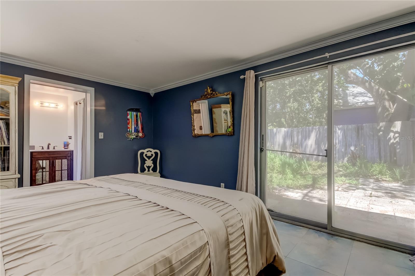 Primary Bedroom with sliders to backyard