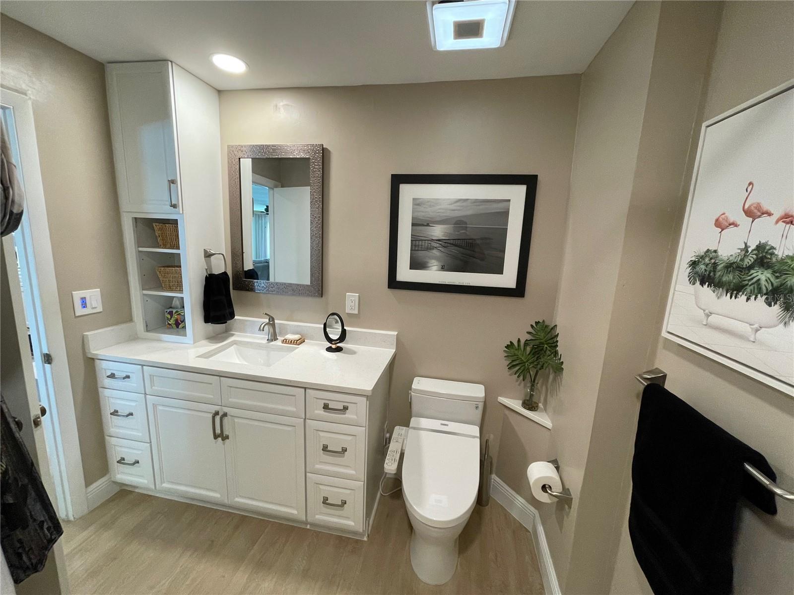 Guest bathroom- quartz counters and wood cabinets