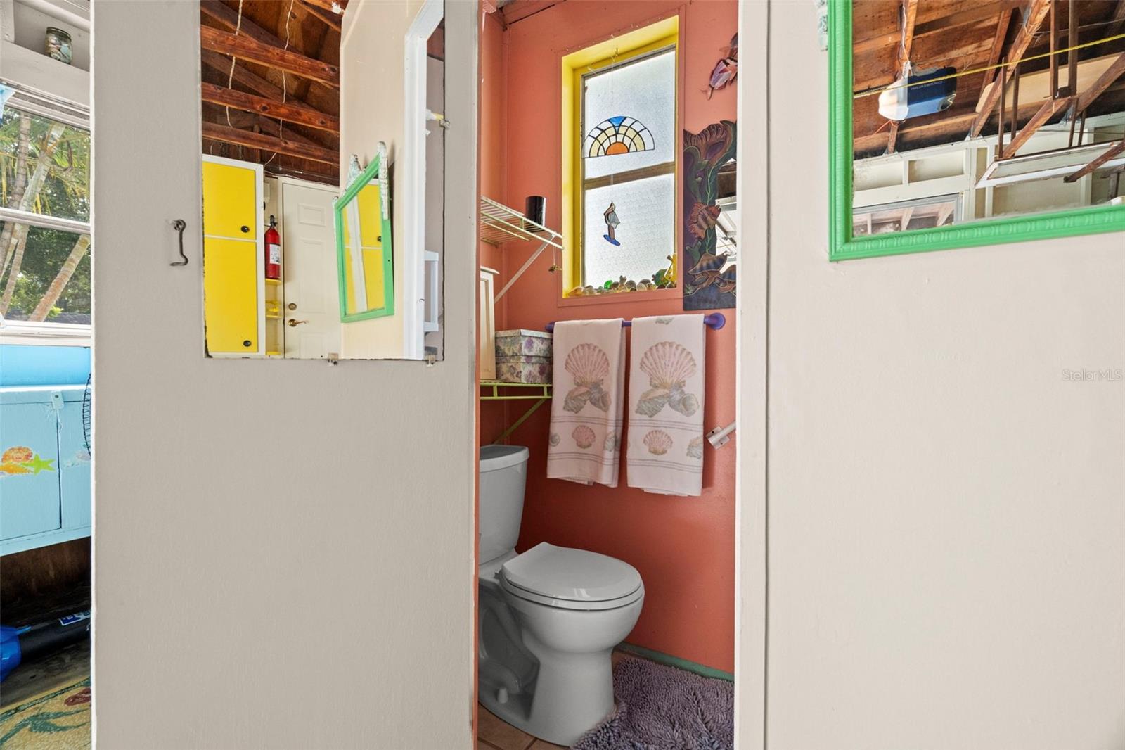 Convenient half bath in the garage.