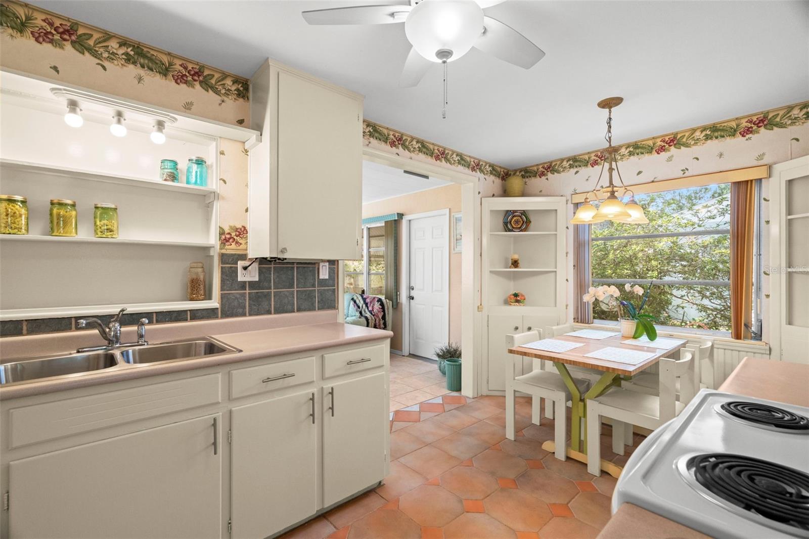 The kitchen offers ample space for a cozy breakfast nook.