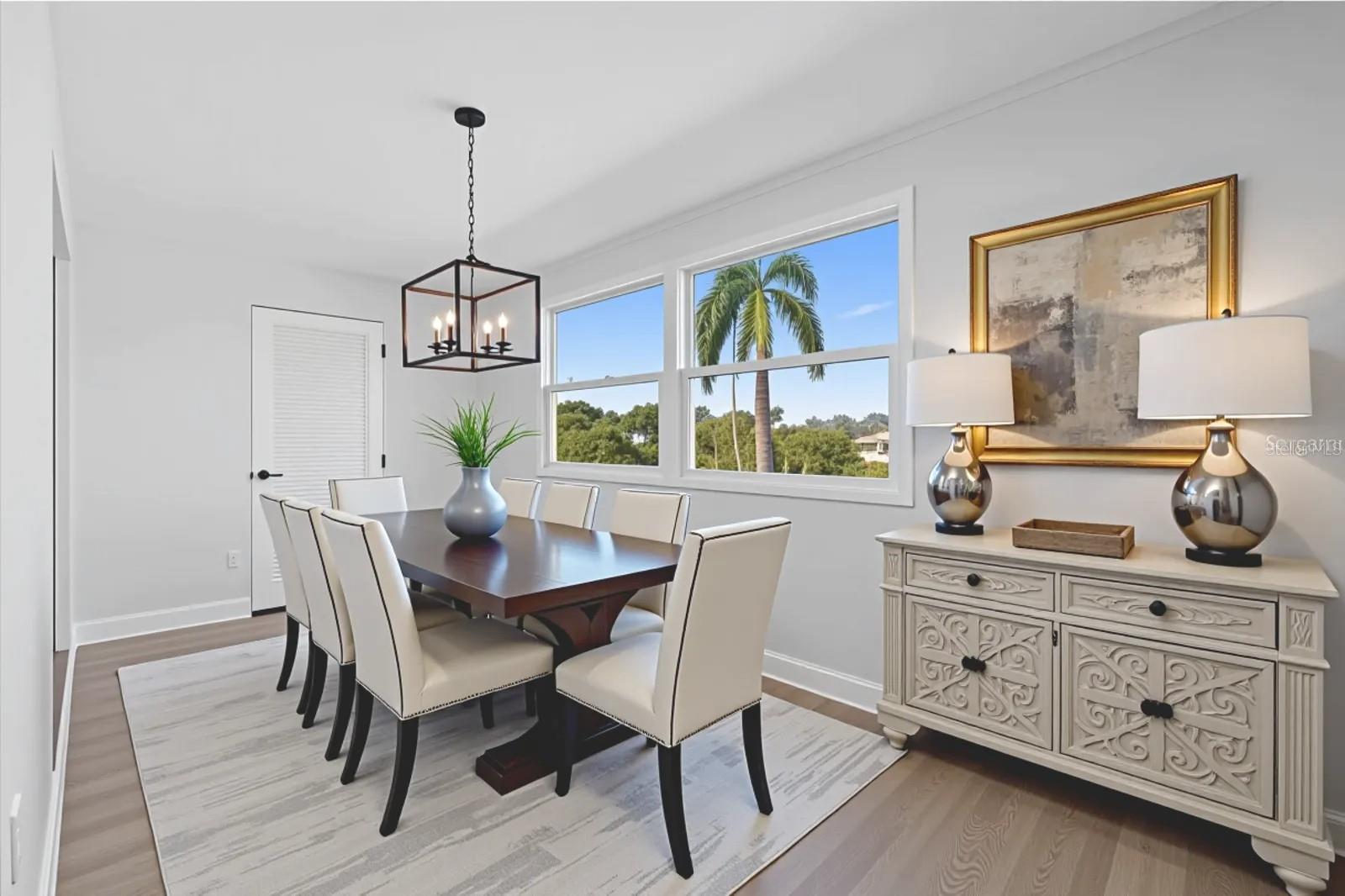 Enclosed sunroom virtually stage as a dining room.