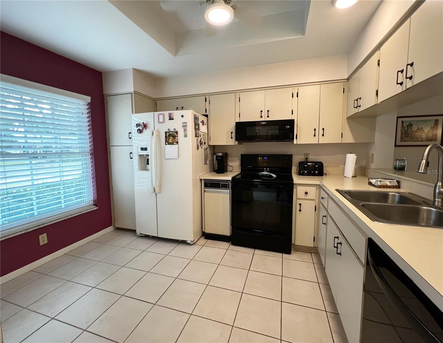 Meticulously maintained kitchen with a big picture window for natural light