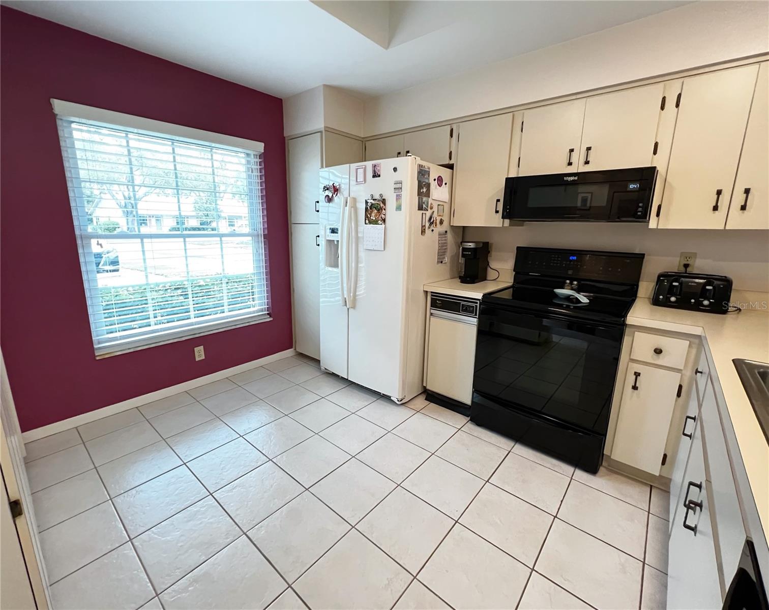 Kitchen at the front of the condo plus room for a breakfast table