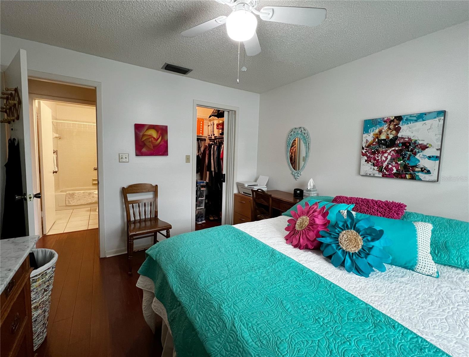 View of the second bedroom with access to the guest bathroom. This hallway can be completely shut off creating privacy of a second master suite! Plus a walk in closet.