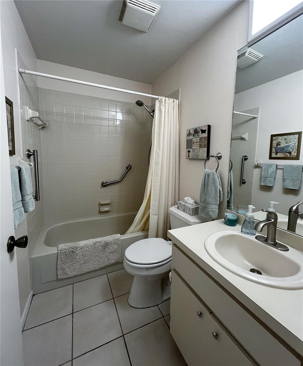 Guest bathroom with a tub/shower combo.