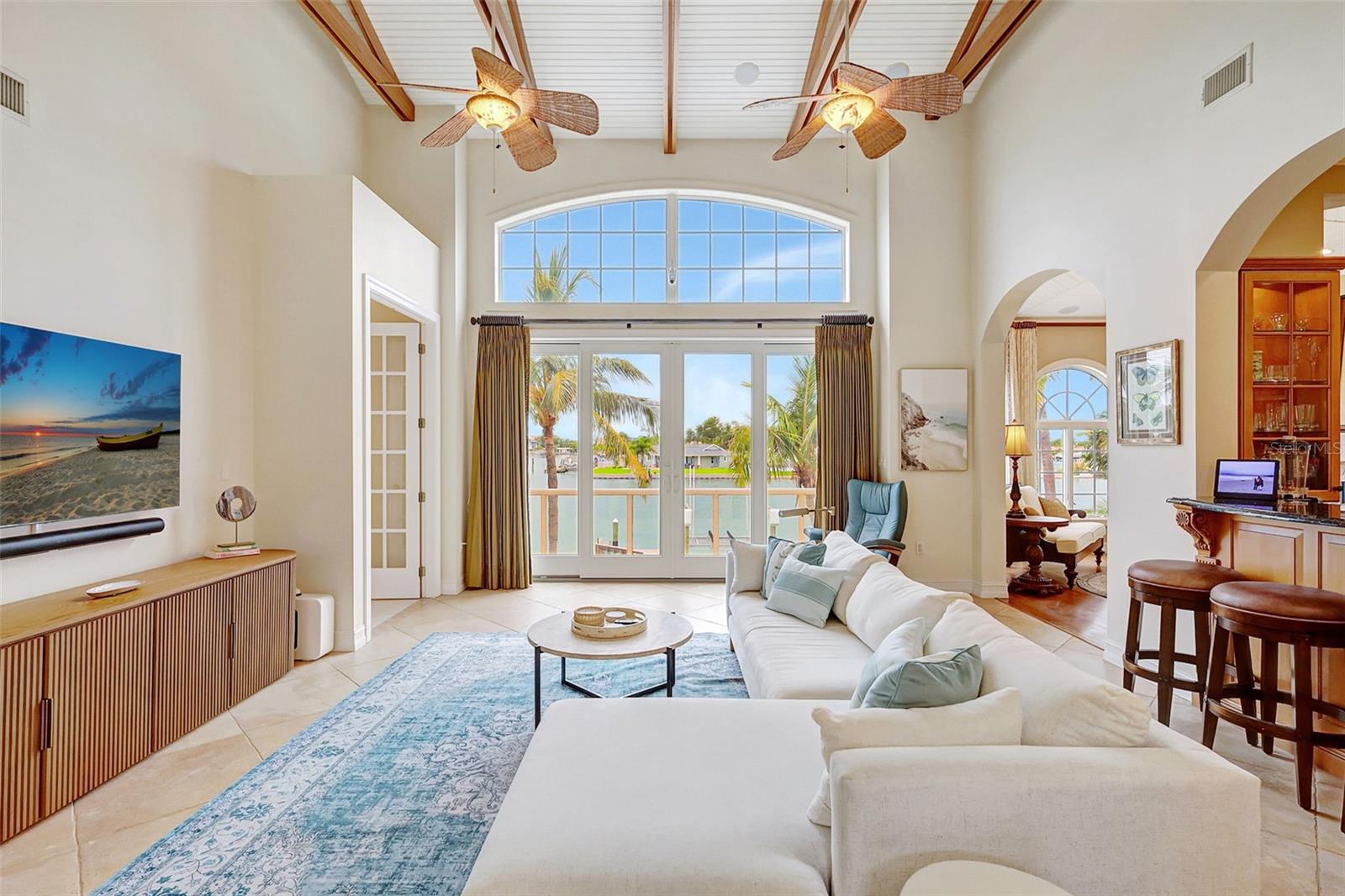 The Large Living Room, With Breathtaking Wood Beams, Leads To A Tiled Balcony.  Just A Few Steps To Your Private Oasis!