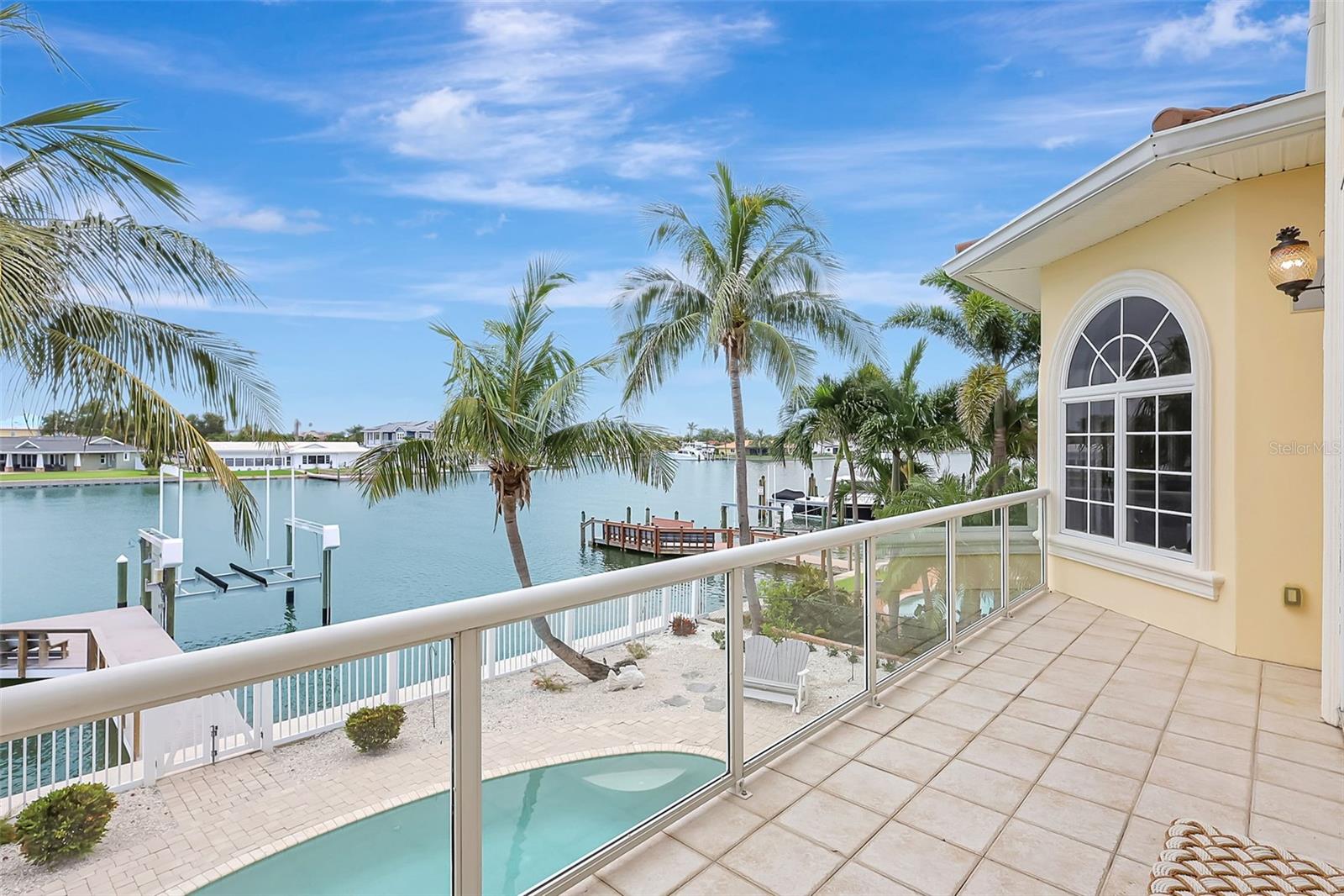 The Glass Railings Are Just Another Great Feature In This Home.  No Water Obstructions If You Are Sitting Down And Relaxing!