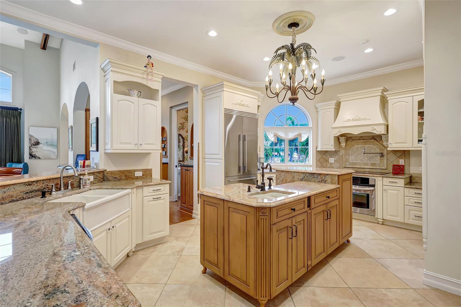 The Custom Designed Kitchen Features A Center Island With A Deep Sink & Plenty Of Storage & Counter Space!